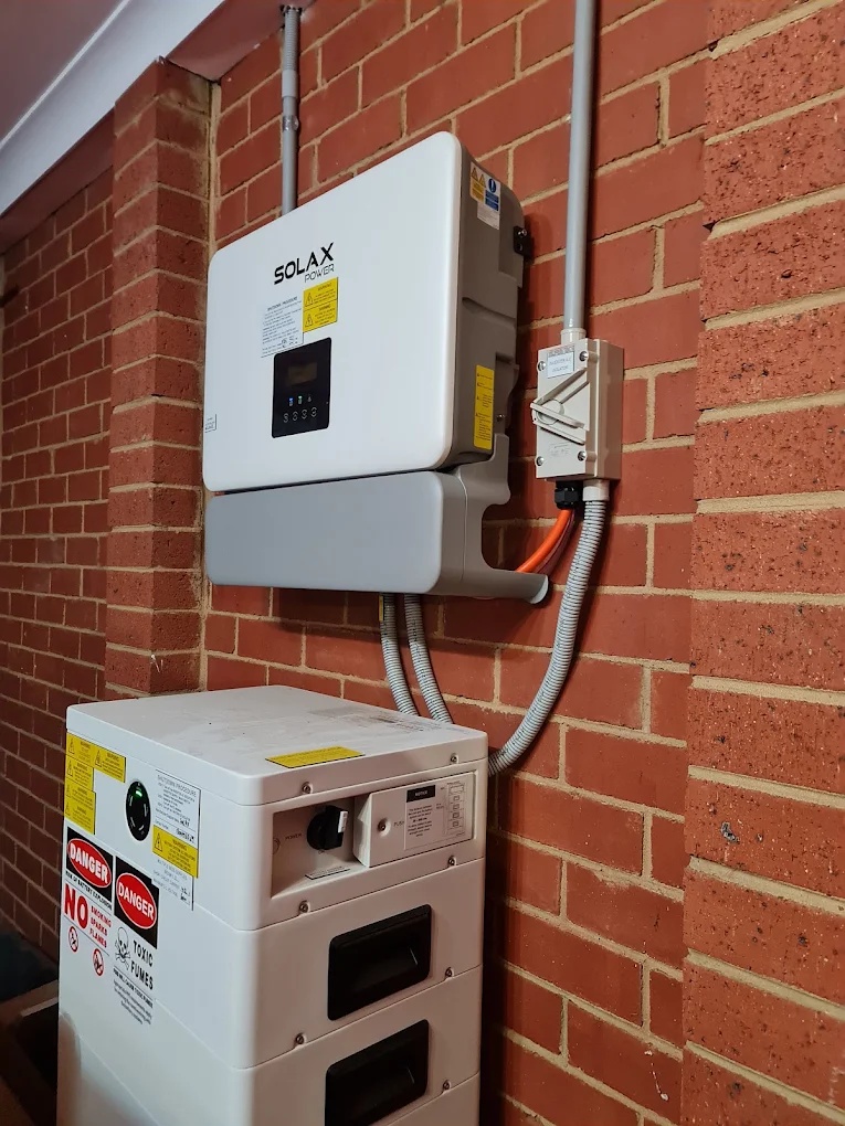 Solar panels on a rooftop overlooking an established Melbourne northern suburb street