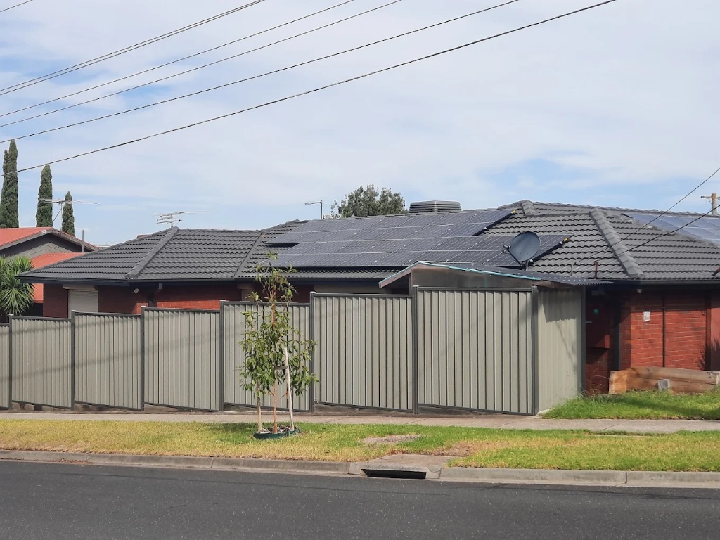 Aerial view of solar panels installed across a northern Melbourne growth corridor estate
